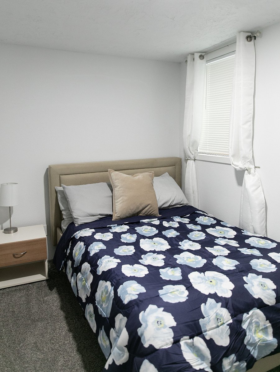 Downstairs bedroom with a full sized bed