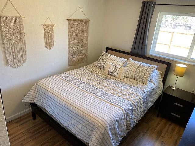 2nd bedroom with queen bed and TV