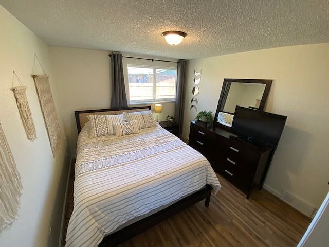 2nd bedroom with queen bed and TV