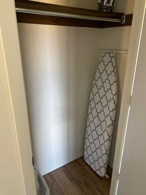 Hall closet with ironing board