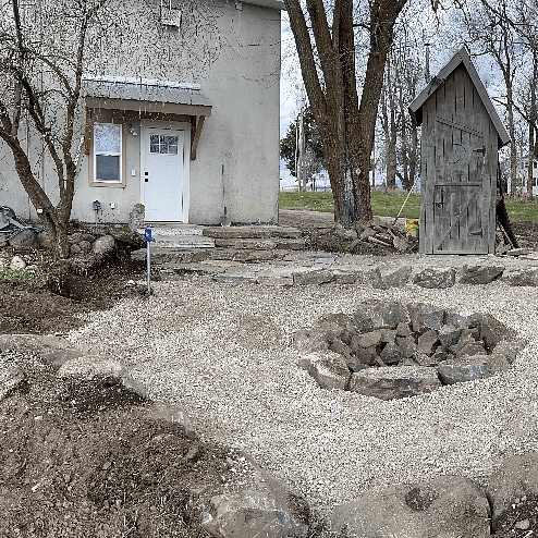 This picture was taken while we were landscaping the new Fire Pit area...we hadn't even painted the door trim or built the private picnic area yet.