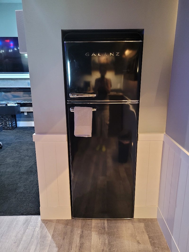 Full-Size Retro Fridge is flushed into wall.