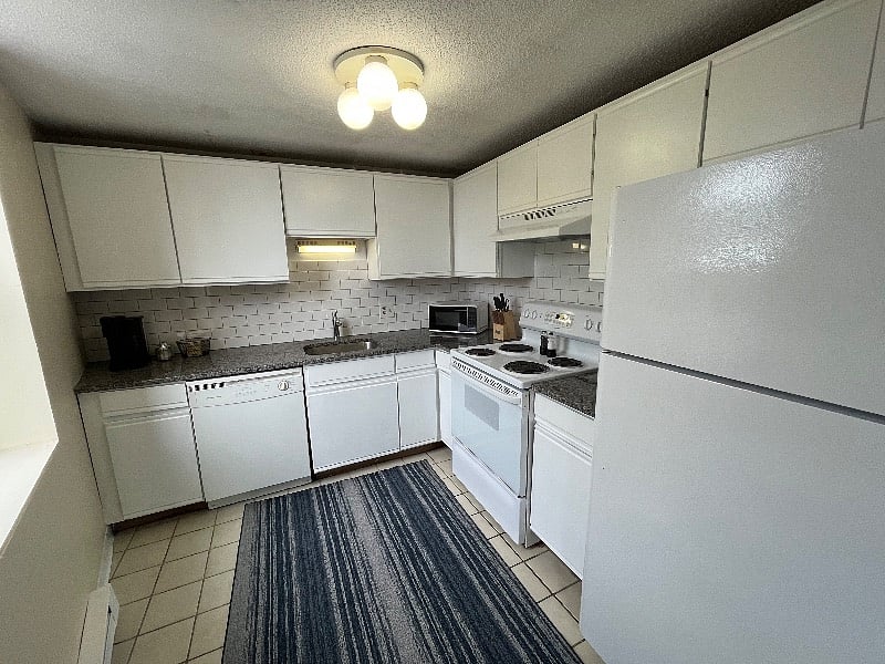 Loads of cupboards store a well stocked kitchen with plenty of room for your grocery finds.