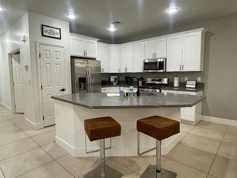 Bar overlooks the kitchen