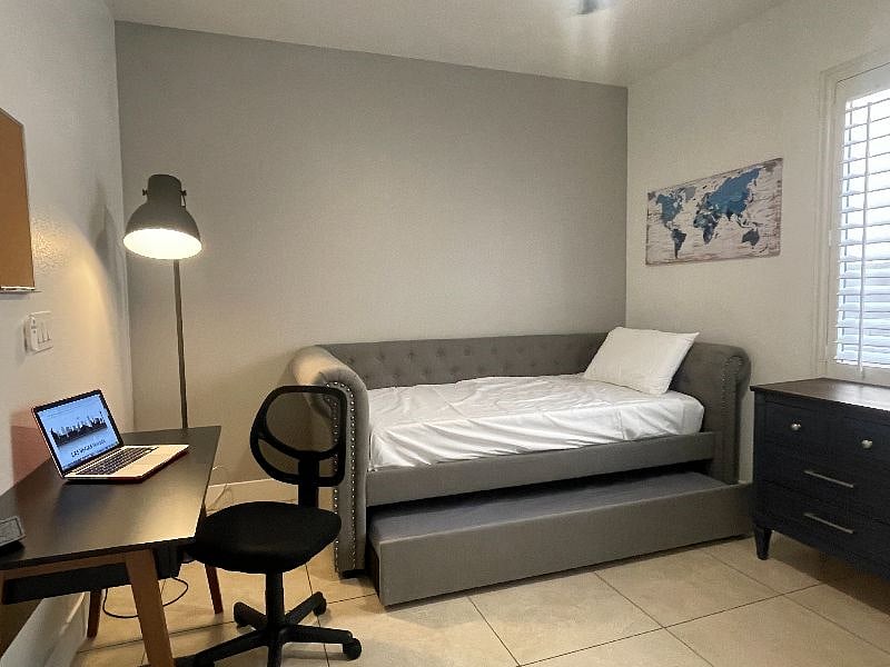 Office with desk, lamps, sofa sleeper, and pull out trundle. Perfect for the younger generations