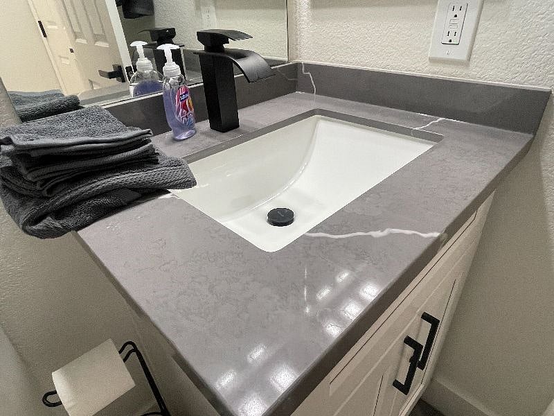 Look at that new quartz countertop and fixtures