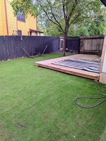 Turfed Backyard with deck and Fence