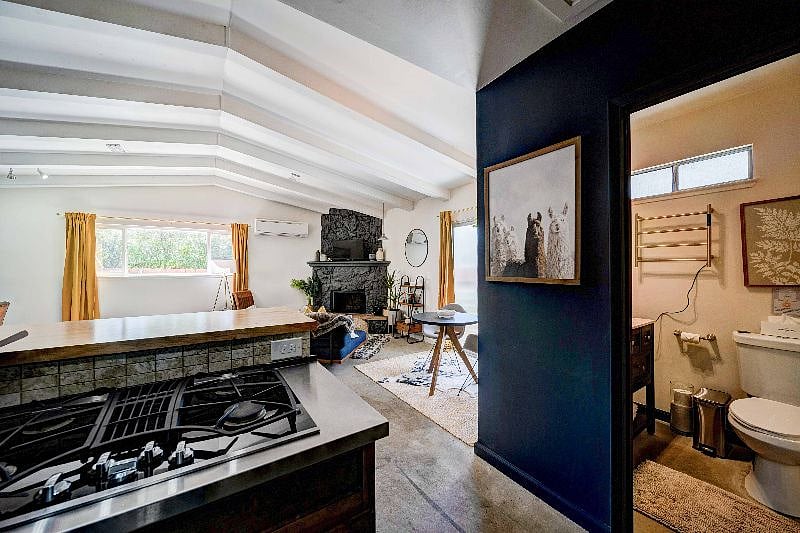Right off the kitchen is the bathroom.
