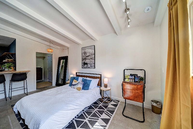 Right next to the bed is the desk for you to get work done while in the space.