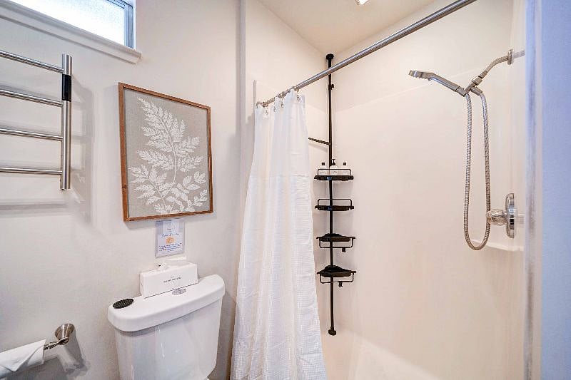 The walk-in shower includes shampoo, conditioner, and body shampoo.