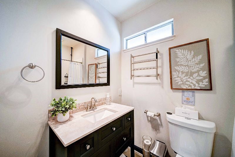 Our full bathroom with a walk-in shower, heated towel rack, and full vanity will make it easy for you to feel right at home.