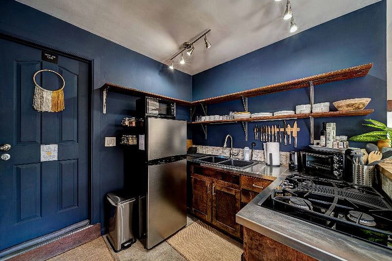 The door leads to the laundry room so that you can use the washer/dryer from 8 am until 3 pm.