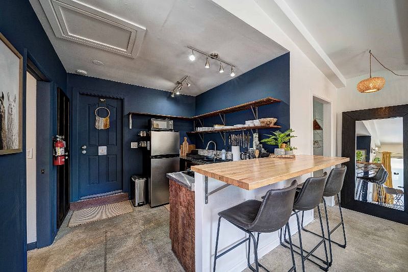 The door leads to the laundry room so that you can use the washer/dryer from 8 am until 3 pm.