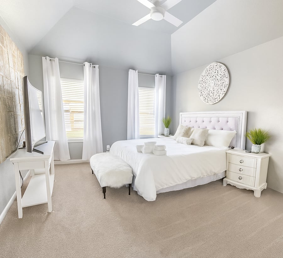 Relax in the Main Bedroom with 65 inch Smart TV. King bed. Also has  private bathroom.