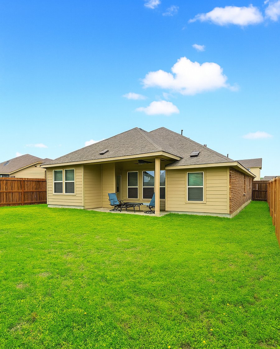Relax and enjoy the huge back yard. The patio has an outdoor fan.