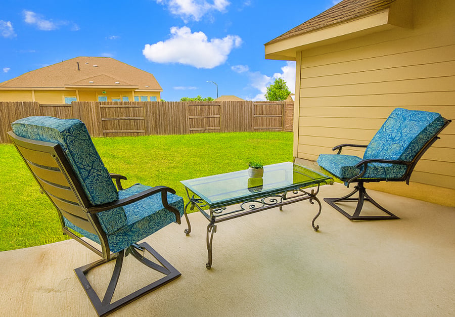 Relax and enjoy the huge back yard. The patio has an outdoor fan.