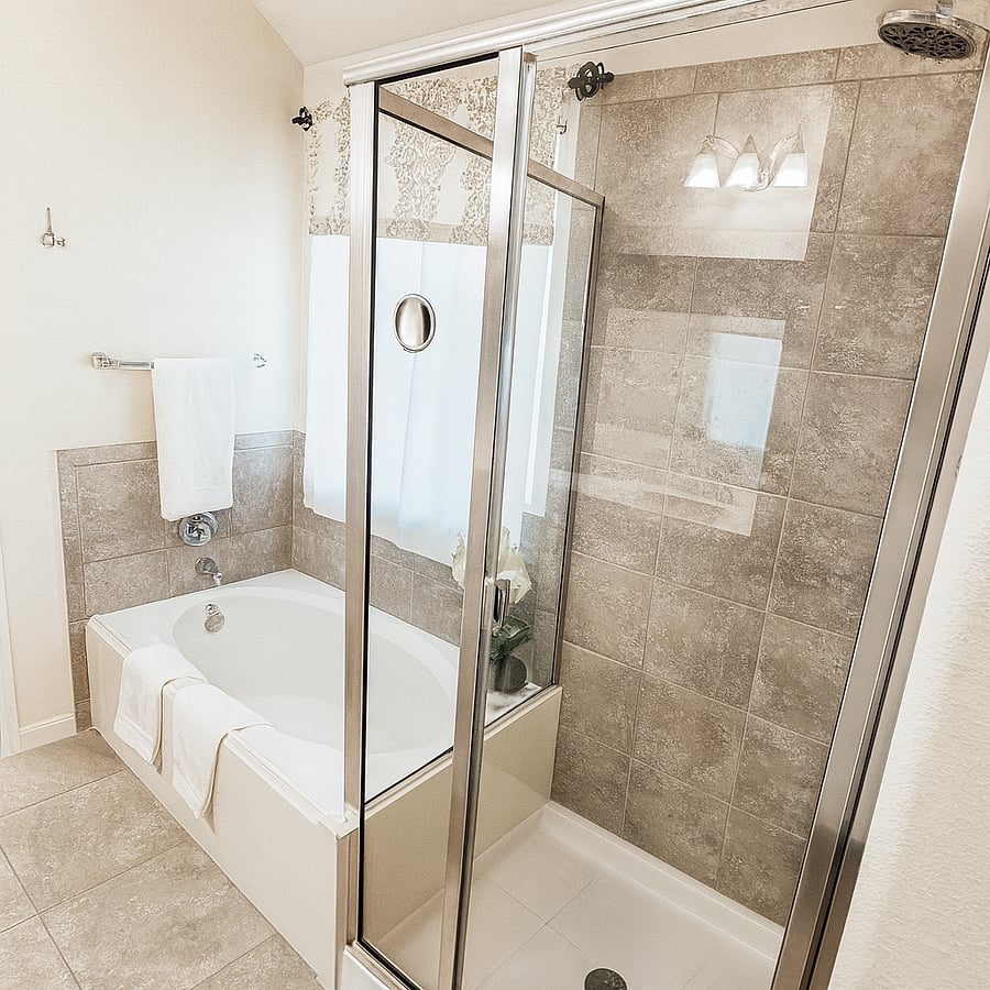 Private attached bathroom to Main Bedroom. Has a full tub, double vanities, shower, walk in closet and private toilet.