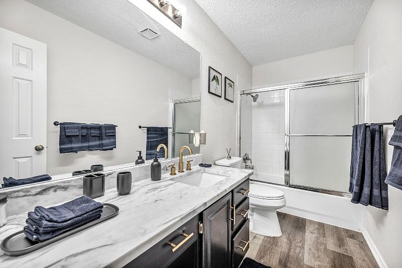 Upstairs full bathroom features a bathtub and shower combination.