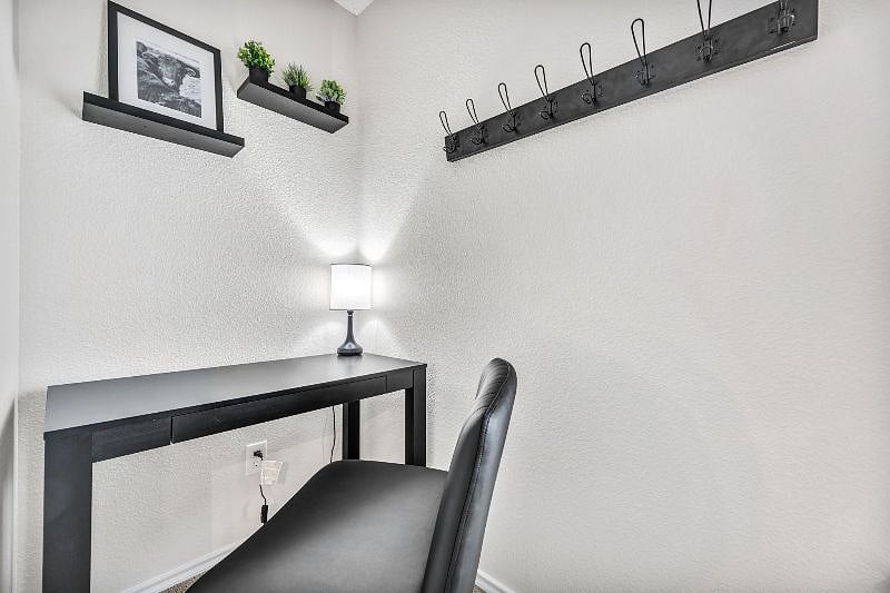Work space is placed by wall outlet for easy plug in access.
