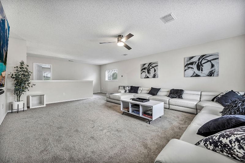 Large leather sectional has slide out seats and adjustable headrests for maximum comfort. Pillows and blankets provided.