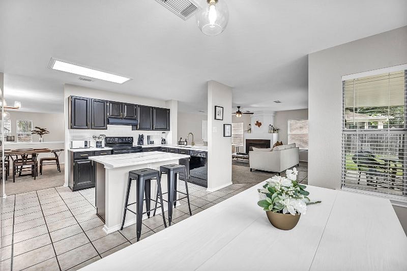 Open layout brings the kitchen, dining areas and family room all together.