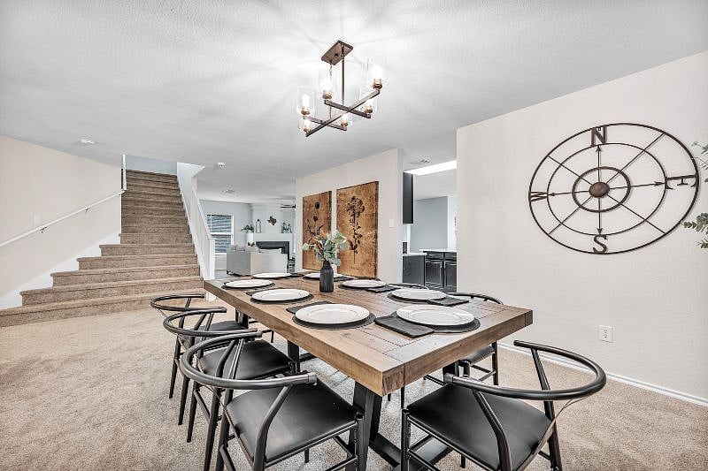 Formal dining area seats 8 people comfortably.