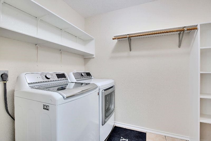 Washer and dryer downstairs in laundry room and walk-in pantry (new touch screen units).