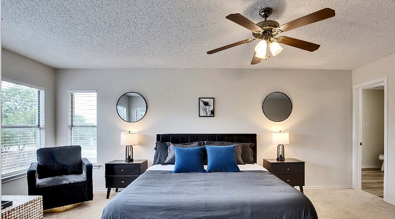 Double nightstands with USB charging station lamps.