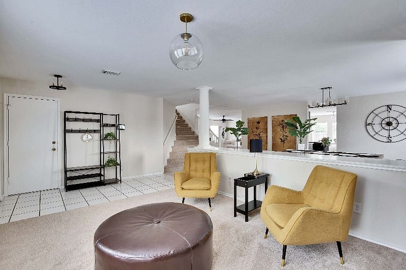 Entryway features a coat rack and double shoe rack.