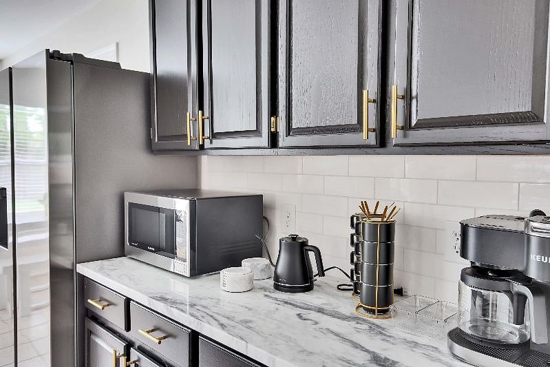 Microwave, electric water kettle and duo Keurig coffee machine (single serve and carafe).