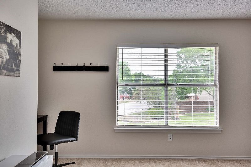 Beautiful view of the front of the home and Gruene Road from the third bedroom.