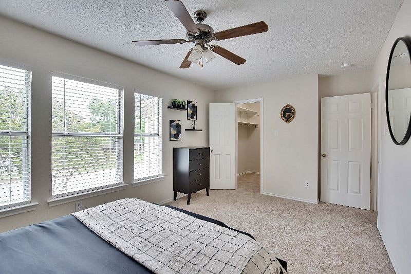 Walk in closet in the secondary bedroom for additional storage. Hangers and laundry basket provided.