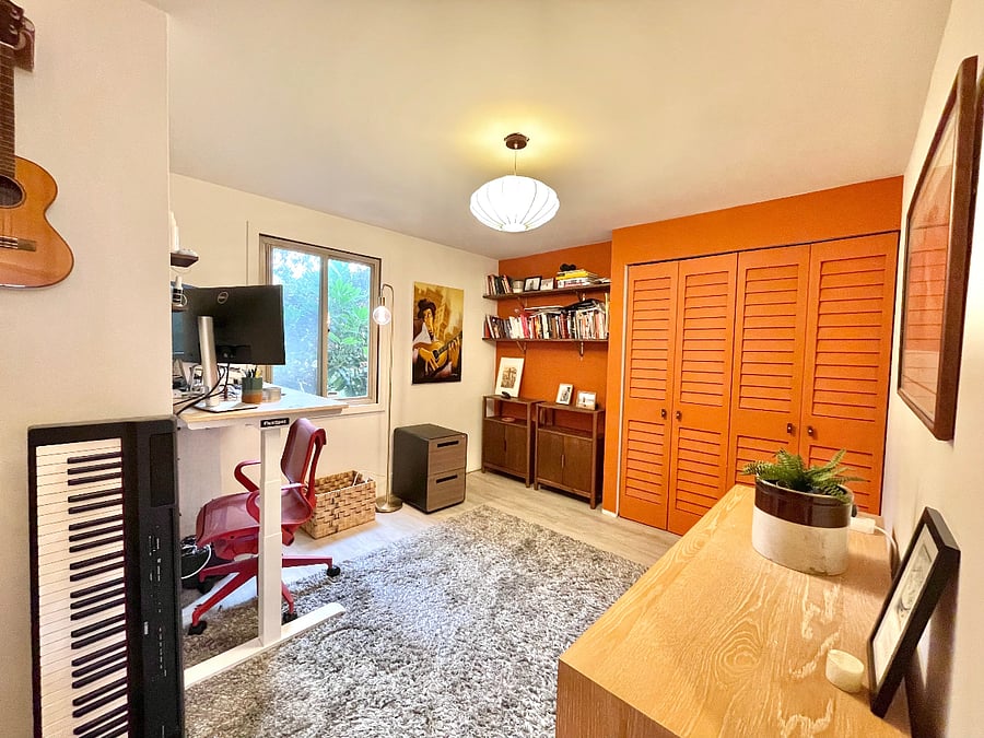 office with sit/stand desk, laundry, and basic workout equipment