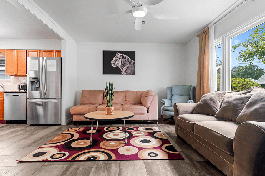 With two cozy couches and a 50-inch smart TV for you to enjoy. This inviting space is perfect for streaming, relaxing, or just kicking back. Your comfortable home base is ready for you!