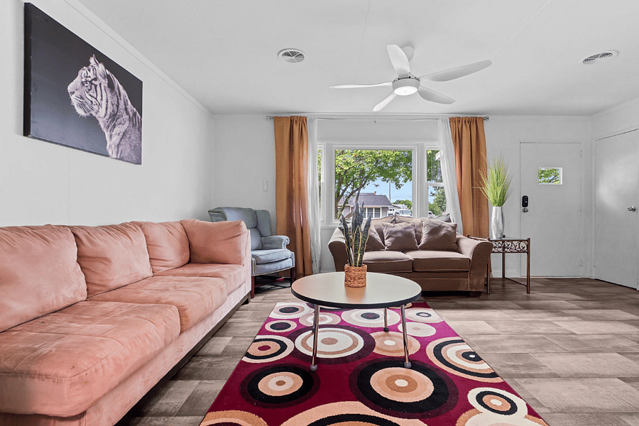 Step into a cozy living space featuring comfortable couches and a large smart TVperfect for relaxing after a day of exploring or streaming your favorite shows. Your chill zone is ready and waiting!