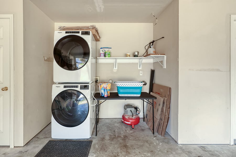 Full size washer and dryer in garage.  Starter laundry soap provided.
