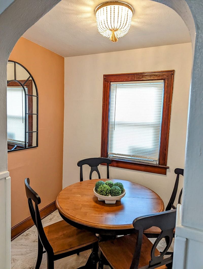 Enjoy your morning coffee in this cute breakfast nook with unique archway.