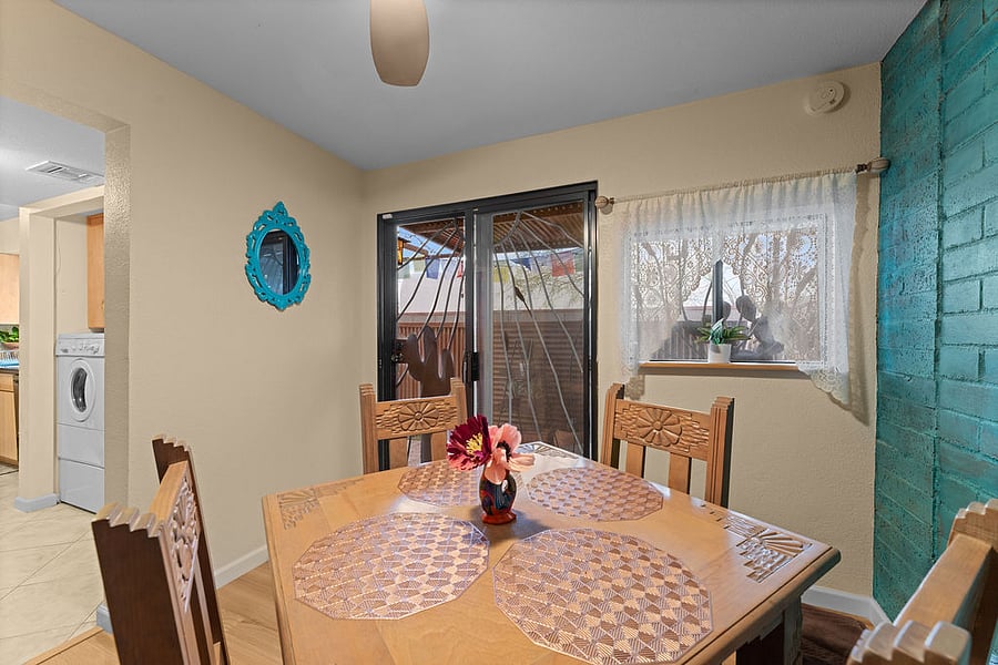 Open the sliding door in the bedroom and you're in the cozy breakfast nook with access to the laundry, kitchen, and back patio. Host leaves this space to guests so that they feel it's all their own!