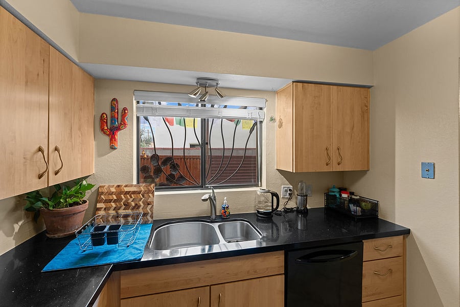 Custom kitchen with granite countertops, soft-close drawers and cabinets, dishwasher, full-sized fridge, oven and stove -- plus all the supplies you'll ever need.