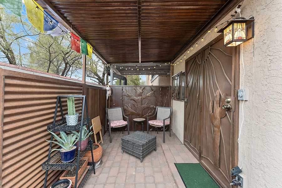 The tiny but mighty back patio has lots of fairy lights, a custom metal mural, chairs to enjoy your coffee or tea, and hooks for 2 hammocks. A hammock is available for you to use or bring your own!