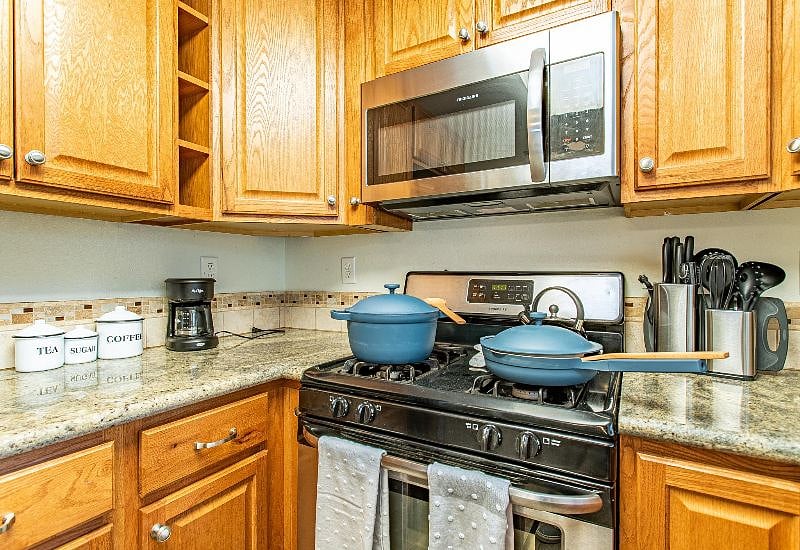 New, stainless steel appliances and granite countertops for enjoying healthy, fresh, home-cooked meals