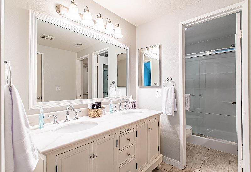 Inset double vanity sink and mirror gives you plenty of room to get ready for the day