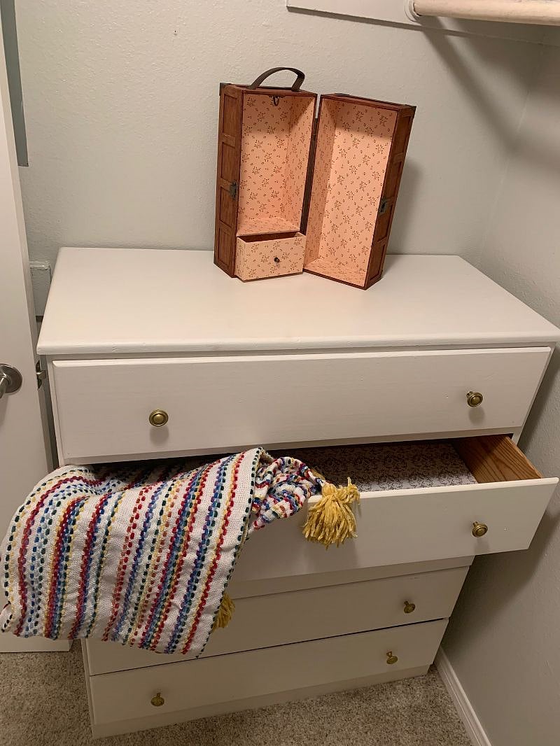 Small dresser inside the walk-in closet makes the smaller clothing items easily accessible