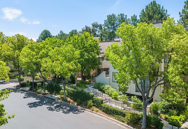 Get your steps in without leaving the neighborhood, shaded by beautiful trees and other professionally maintained landscaping in this desert oasis
