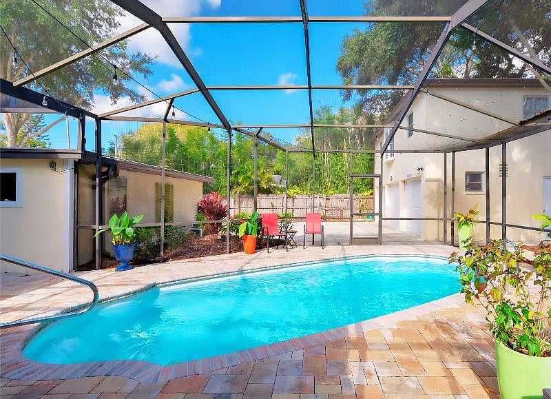 Screen-Enclosed Pool, Pavered Terrace, Access to Shared Laundry Facilities - SHARED AMENITY 