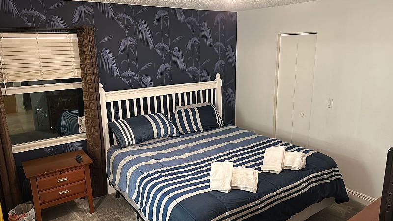 King bed with linens. Additional linens are ready in the linen closet in the bathroom.