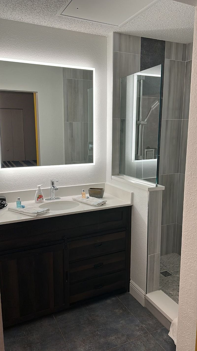 Spacious Bathroom with a barn door for easy access. Hairdryer included.