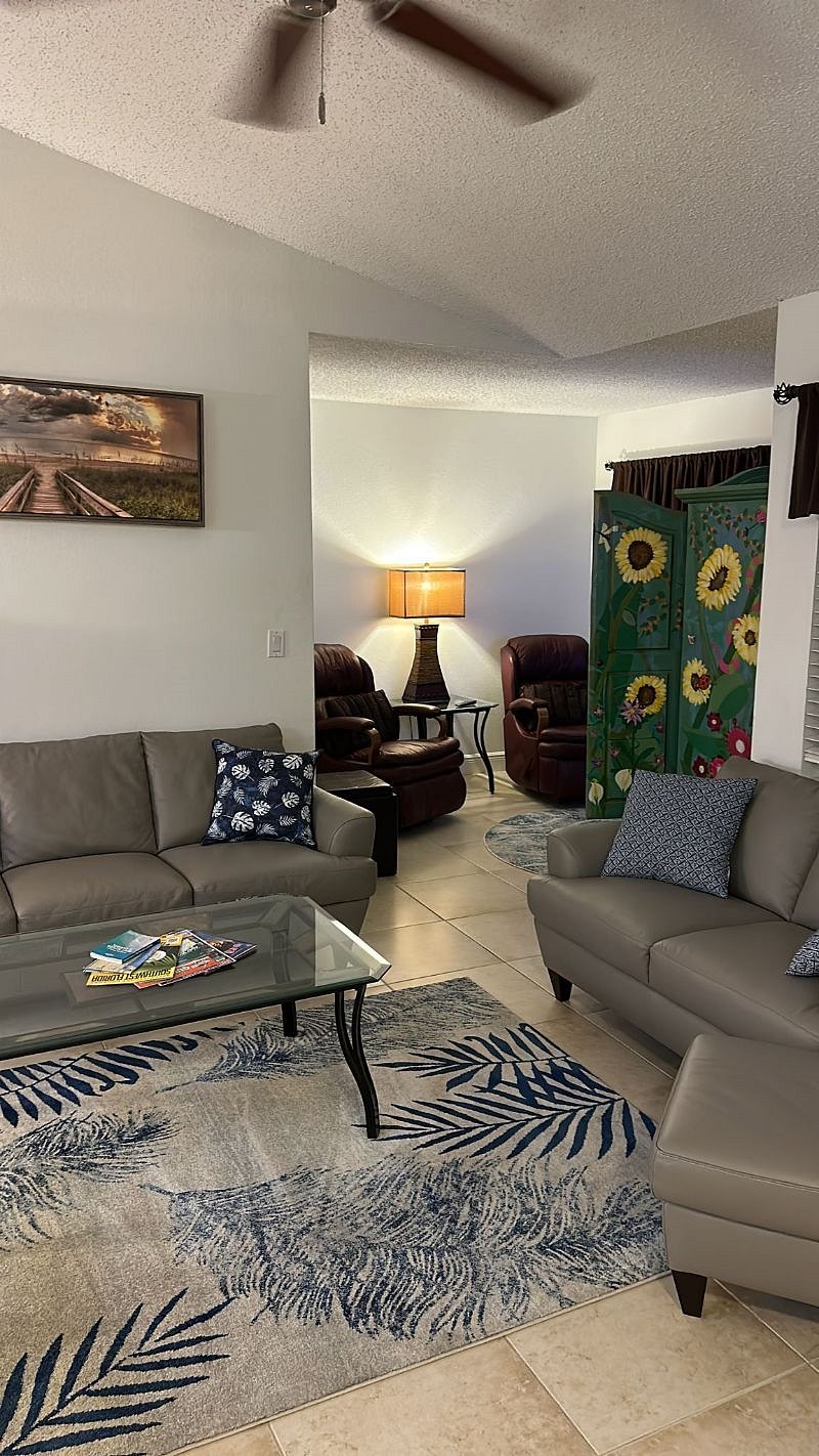 Living room with view into TV area.