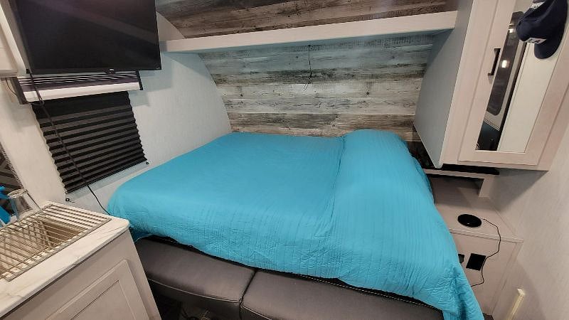Queen size bed fits 2 comfortably with added topper making it extra cozy and comfortable!