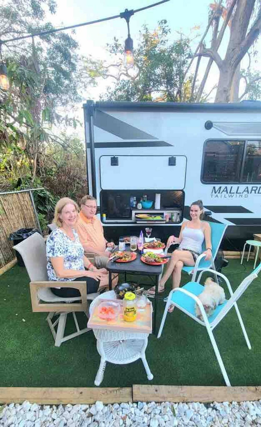 Outdoor kitchen with refrigerator, sink, counter space and grill! Perfect for outside dining!